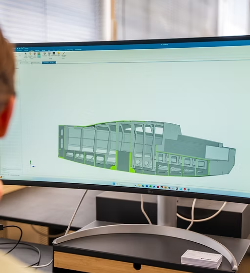 Tecnify engineer working on a vessel model